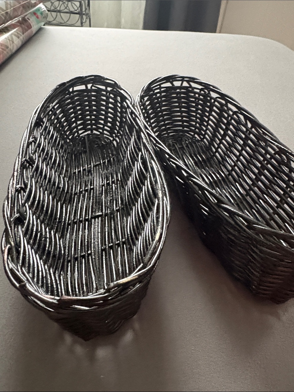 2 black wicker basket 12 in by 3in deep
